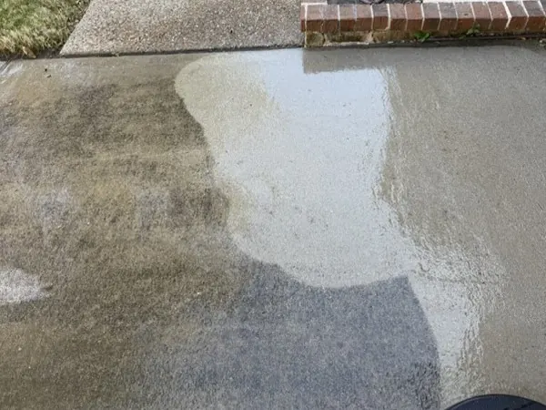 Concrete side drive, half cleaned to show the difference