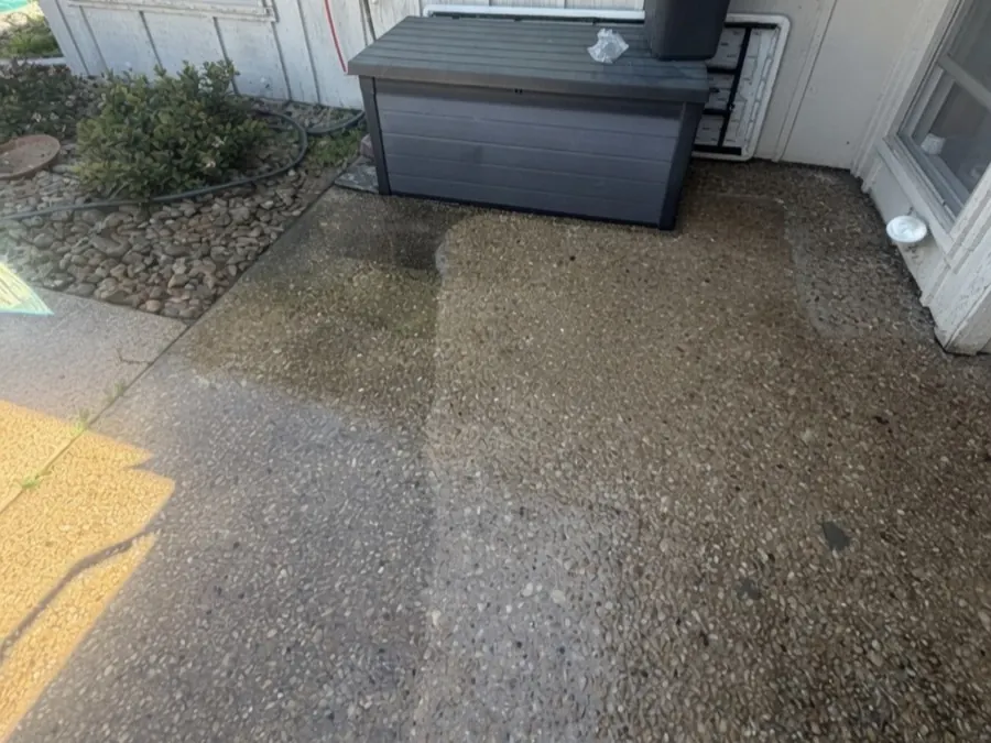 Concrete patio mid-clean, half cleaned to show the difference