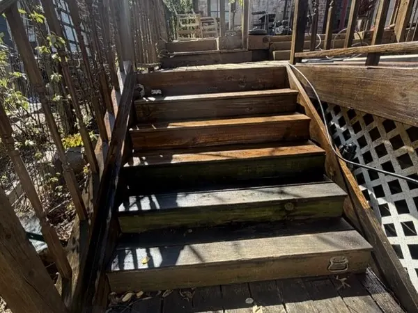 Deck stairs mid-clean, half cleaned to show the difference